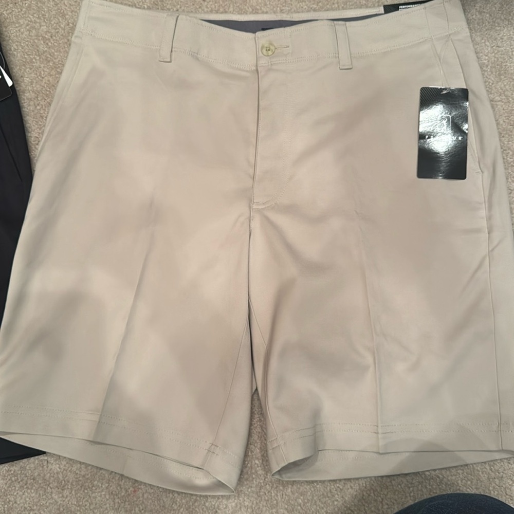 Two pairs of new men’s golf shorts
